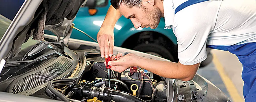 mechanic-working-on-car-india-tools