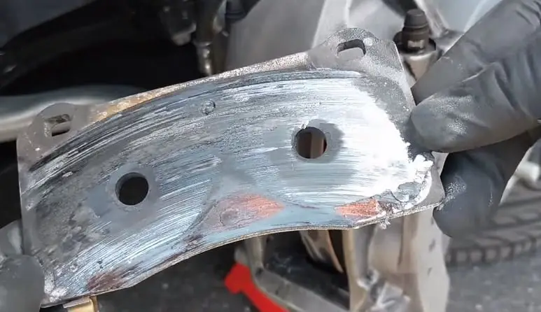 worn brake pad grinding on rotor